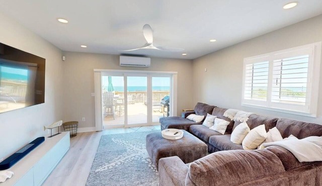 Luxurious oceanfront townhome with private deck and panoramic coastal views