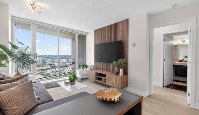 Modern & Spacious 2BR + Den Near BC Place Parking Pool in Vancouver
