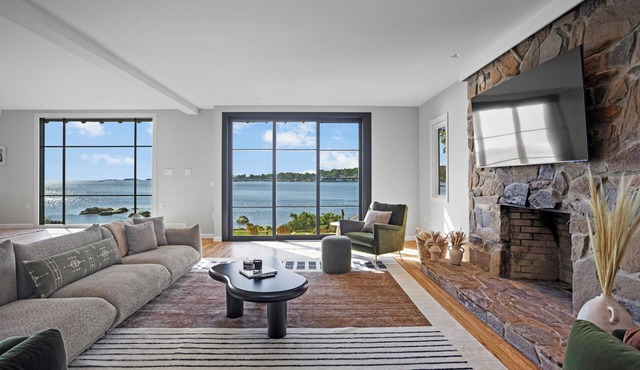 Modern Waterfront Oasis with Private Beach and Sunset Views