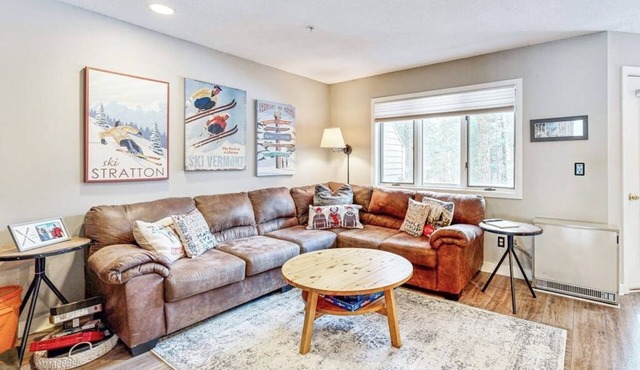 Mountain-view condo with private balcony, fireplace, & updated interior