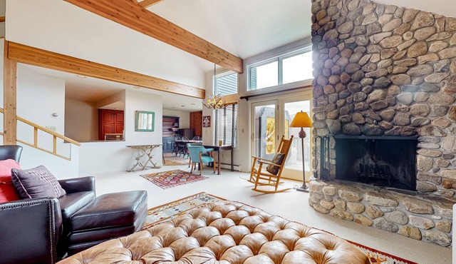 Mountain-view resort home with wood fireplace, private hot tub, grill, & deck