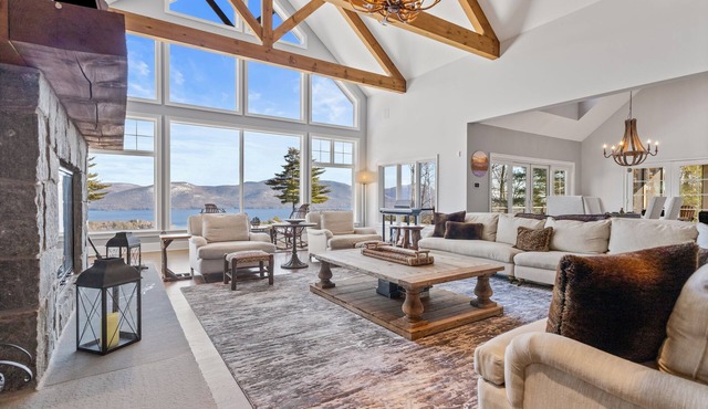 Panoramic lake view acreage with game room, sauna & fireplace