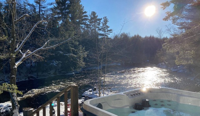 Peaceful Forested Riverside Cottage with a Hot Tub, Cozy Vibes & Pets Welcome