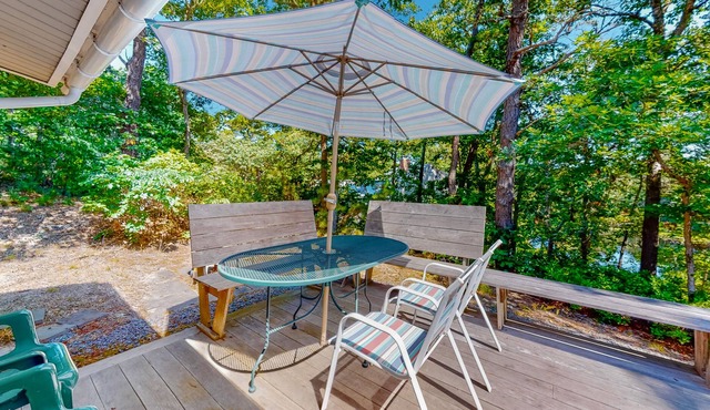 Peaceful woodland home with spacious property, pond views, & outdoor dining