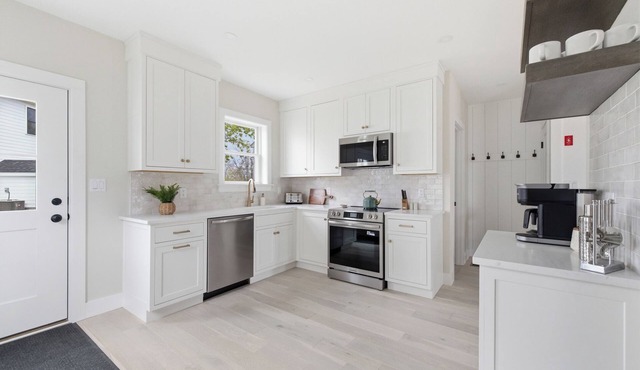 Seaside luxury meets unbeatable location. This stylish 2BR/2BA retreat is steps from Dock Square KPT's restaurants, shops, and galleries, and includes beach gear and a private fire pit.