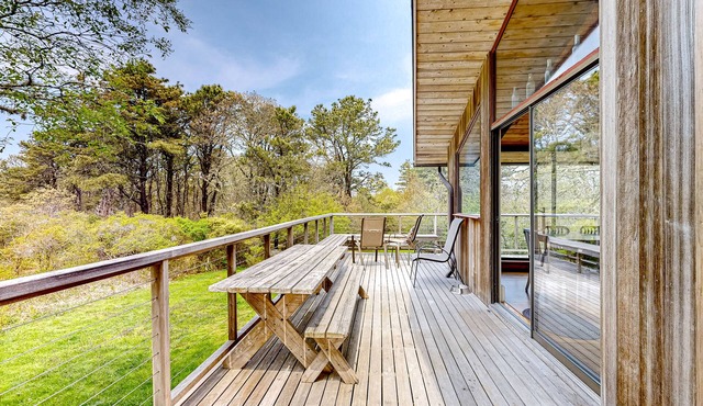 Secluded mid-century home with wraparound deck, yard, grill, partial AC, & W/D