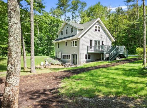 Sunny, lakefront home on South Pond with private dock, great deck & firepit