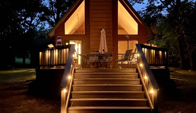 This relaxing cabin is cozy and secluded with private pond and fishing dock in Kingston