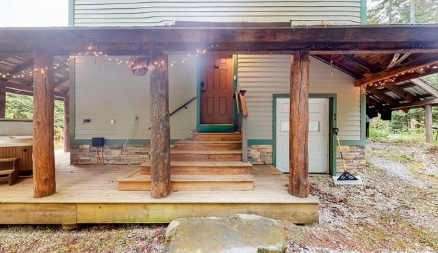 Three-level dog-friendly getaway with a private hot tub, fireplace, & W/D