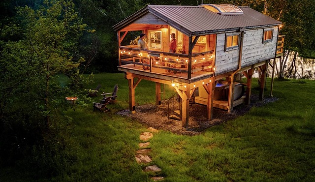 Treehouse lifted up over a stocked trout pond up in the beautiful birch trees!