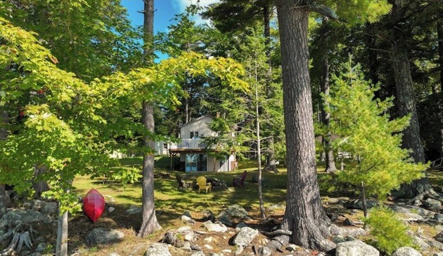 Two-story lakefront home with a seasonal dock, furnished deck, & washer/dryer