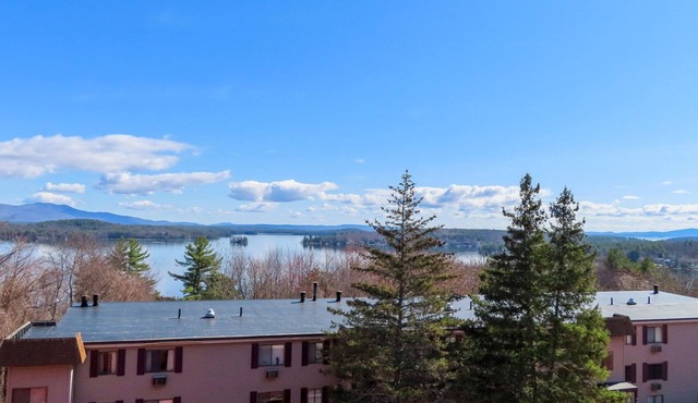 Water view condo with a pool, tennis court, fireplace, balcony & golf nearby