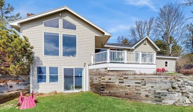 Waterfront home with furnished deck, ocean views, & full kitchen