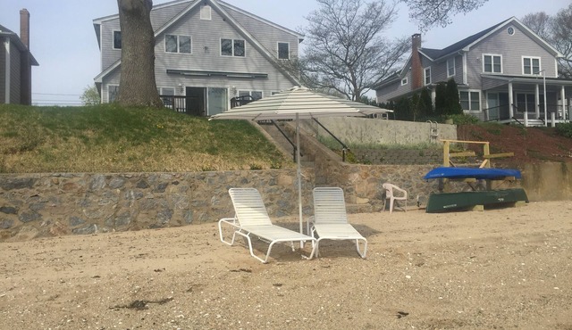 Waterfront home with private sandy beach on Niantic River.
