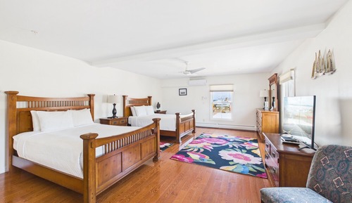 Room 2: Two Queen beds, private bath.