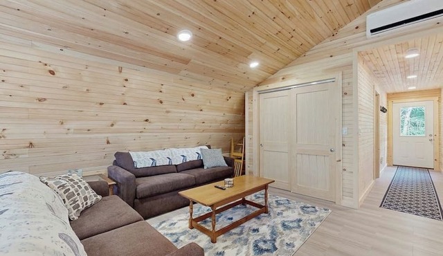 Charming apartment with waterfront access, modern comforts, and lakeside firepit